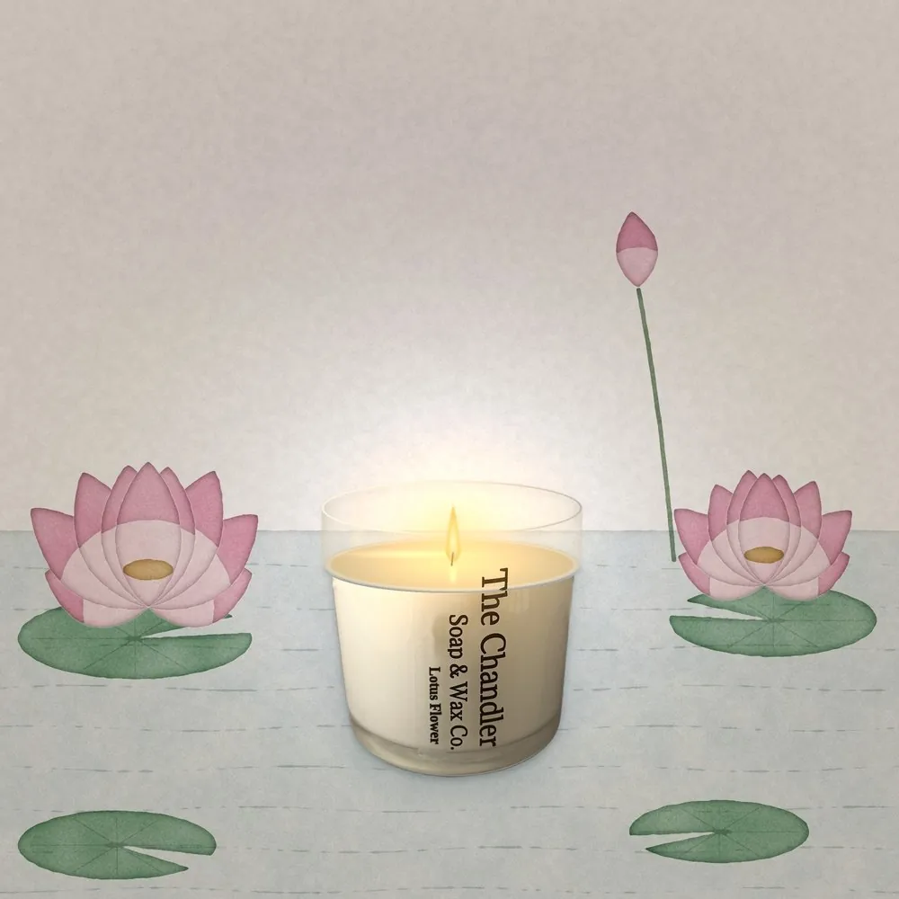A lit Lotus Flower candle with a full melt pool, among watercolour lotus flowers